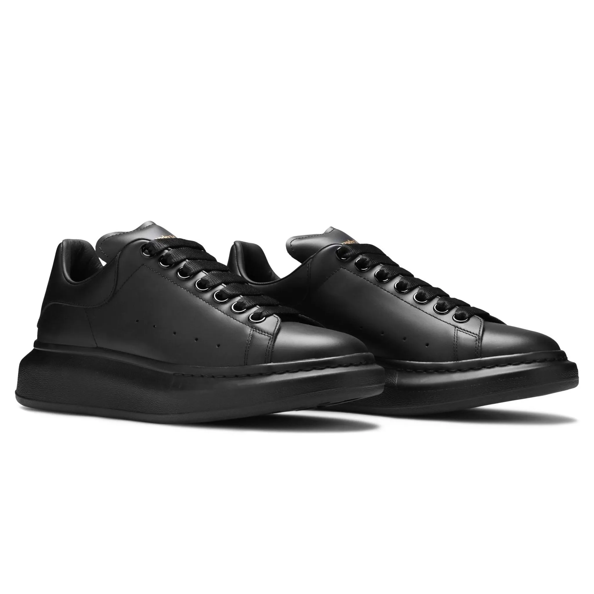 Alexander Mcqueen black sneakers triple raised sole.