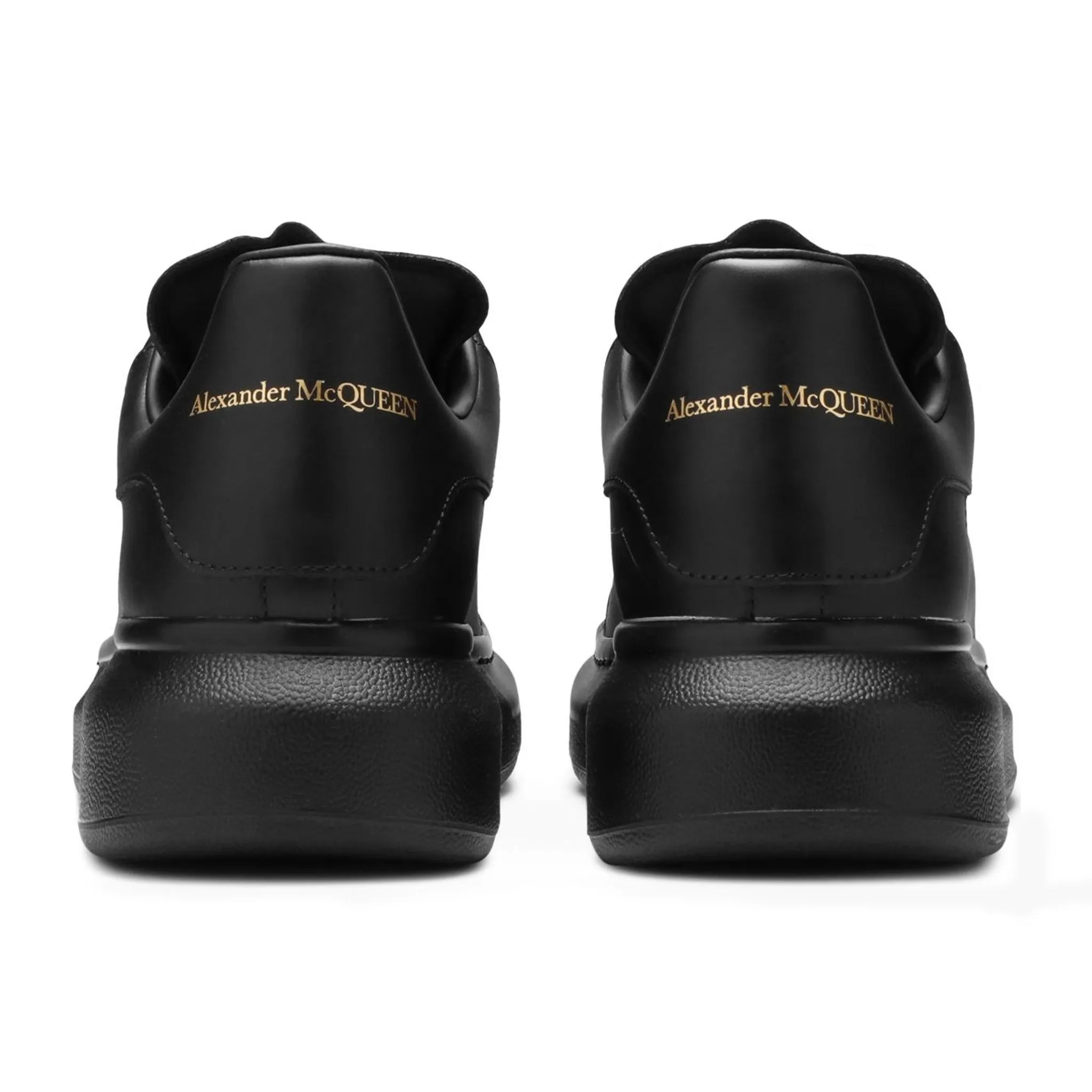 Alexander Mcqueen black sneakers triple raised sole.