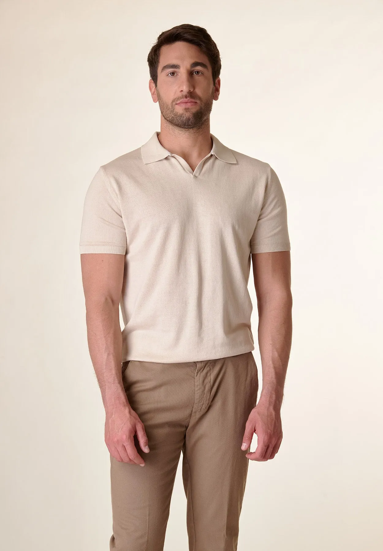 Beige derby collar buttonless polo shirt.