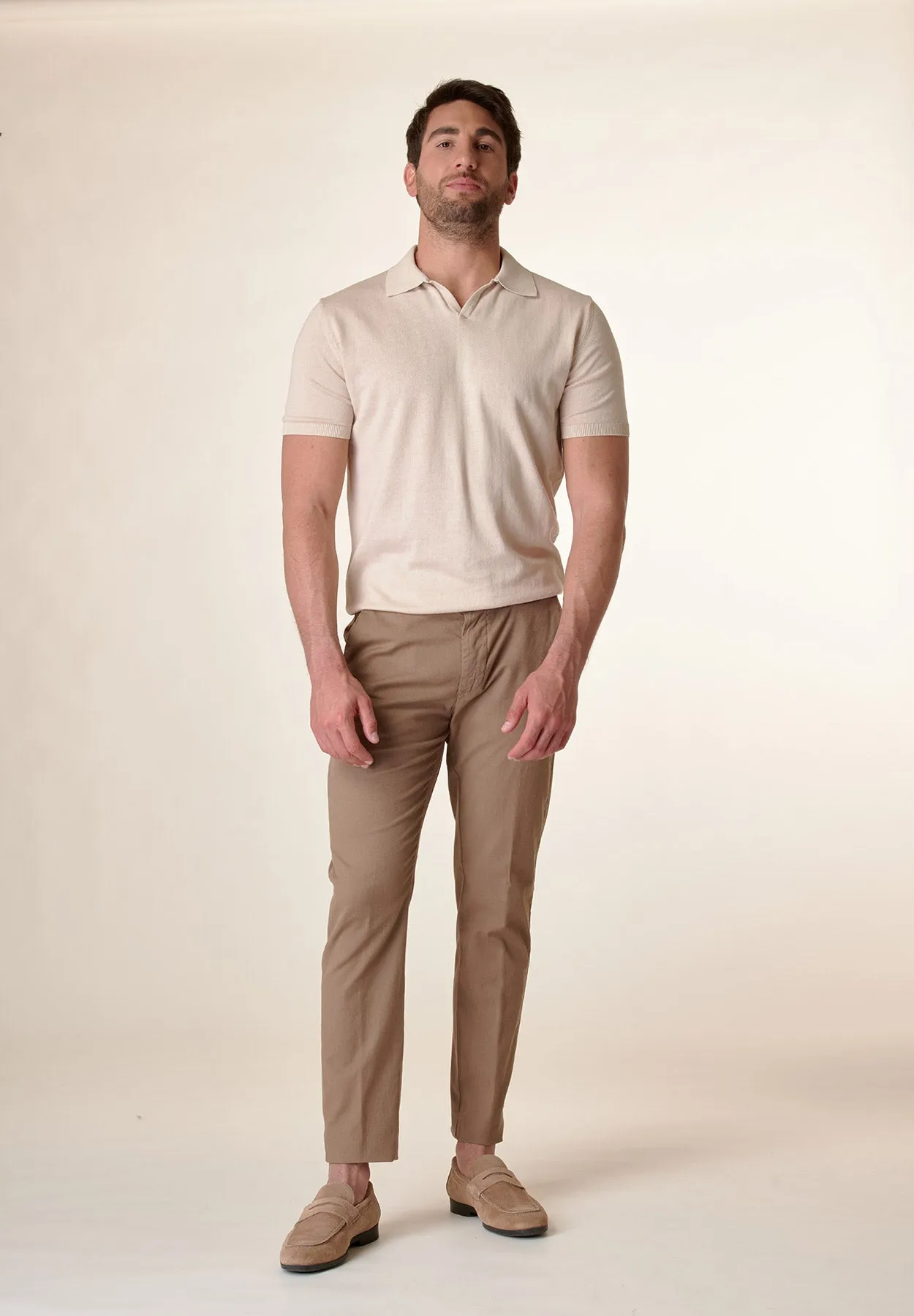 Beige derby collar buttonless polo shirt.