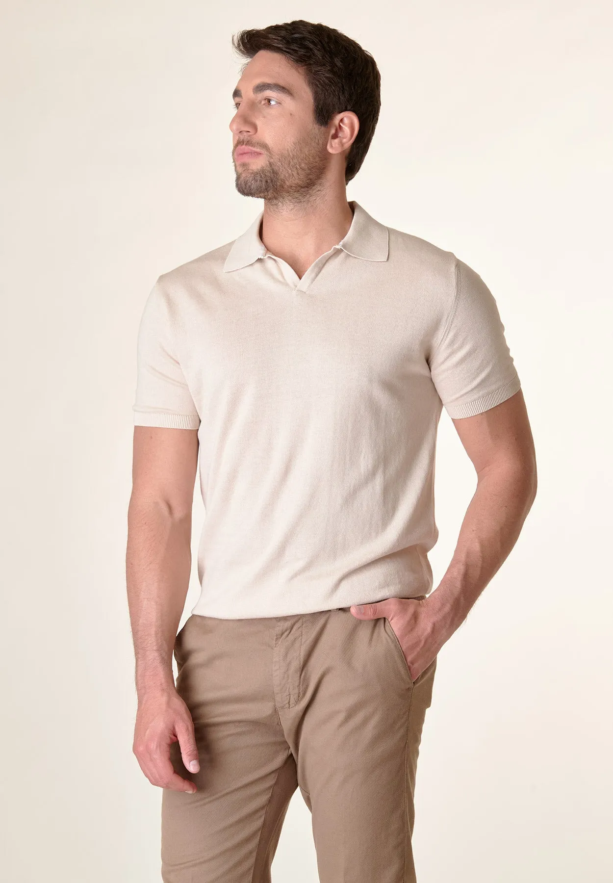 Beige derby collar buttonless polo shirt.