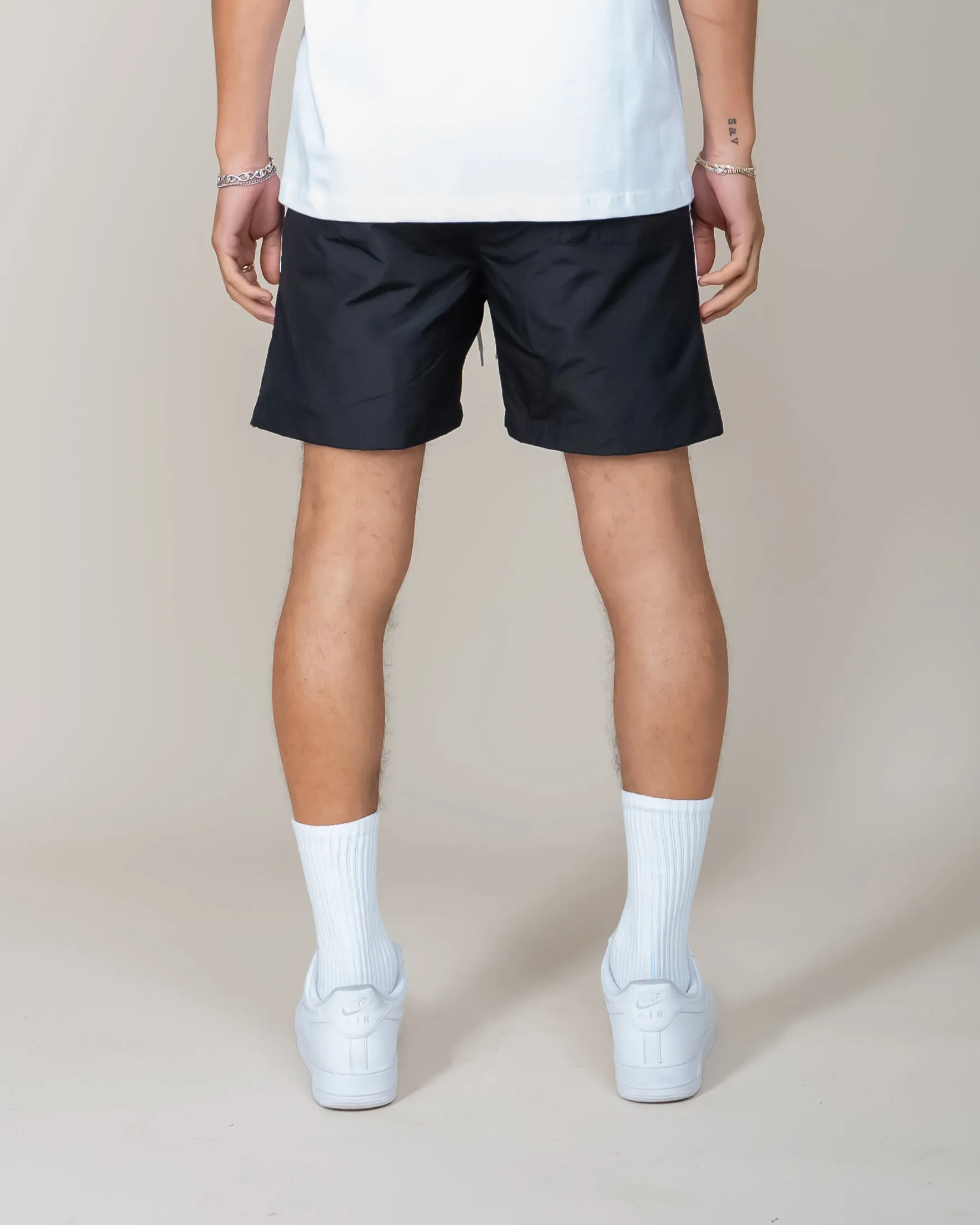 EPTM black derby shorts.