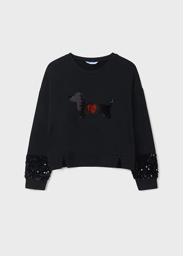 Teen girl black pullover.